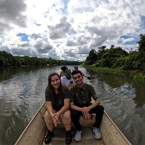 Two people take a boat ride in the Pantanal